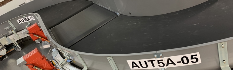 Powered Curve Systems for Airport baggage handling