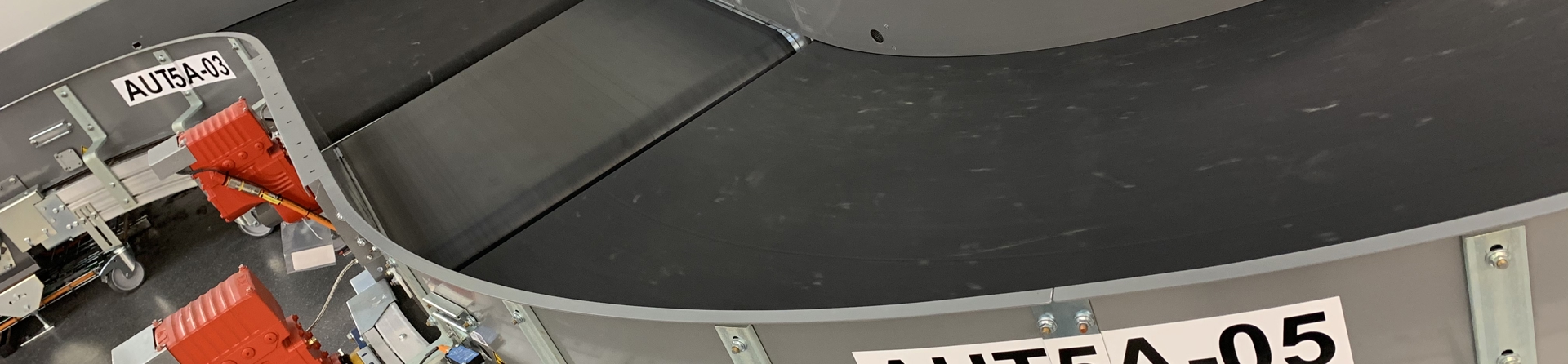 Powered Curve Systems for Airport baggage handling